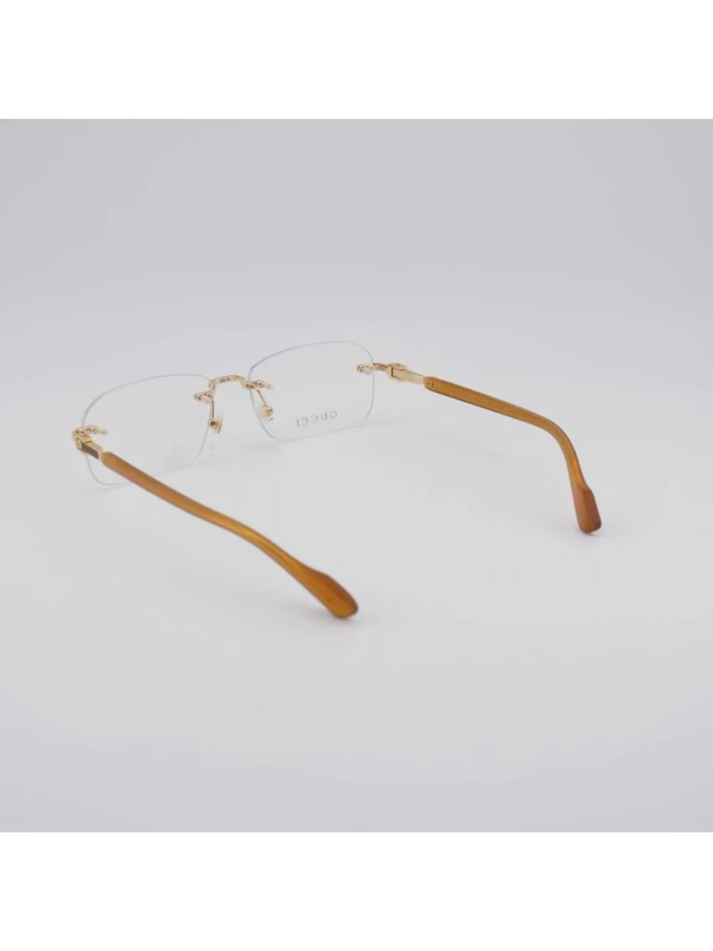 Gucci GG1221O 006 Rimless Eyeglasses Gold 56mm Rectangle Frame
